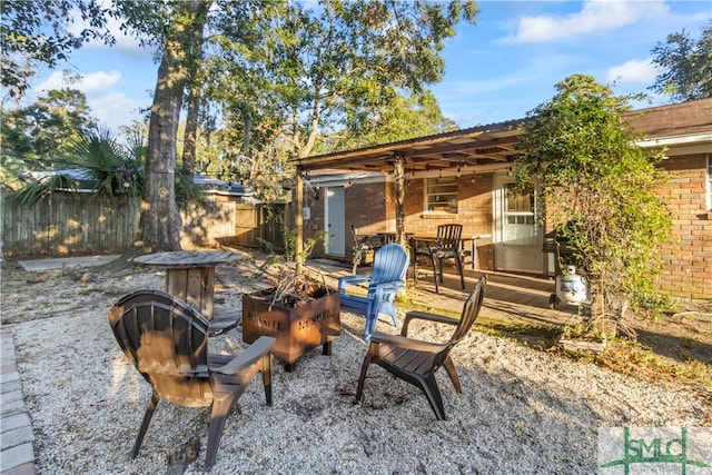 view of patio with an outdoor fire pit