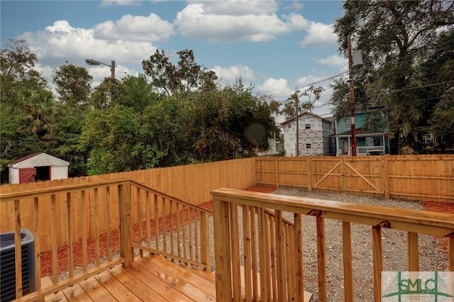 wooden terrace featuring central air condition unit