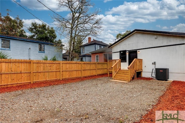 view of yard with central AC unit