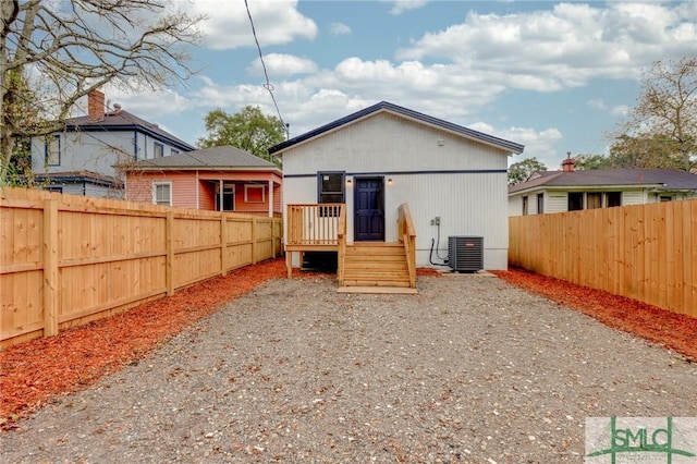 back of house featuring central AC unit