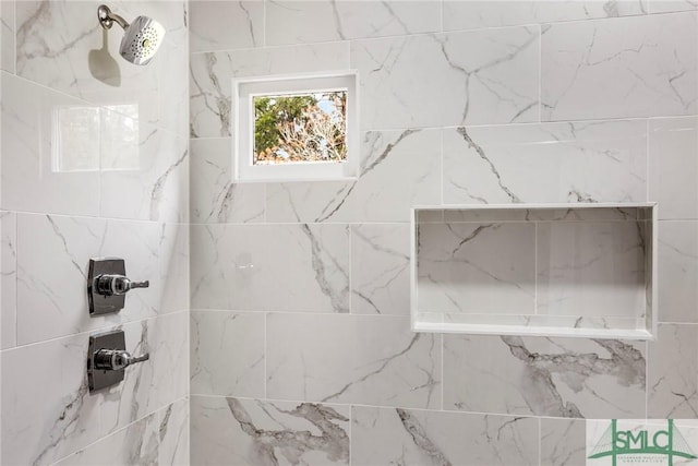 bathroom featuring tiled shower