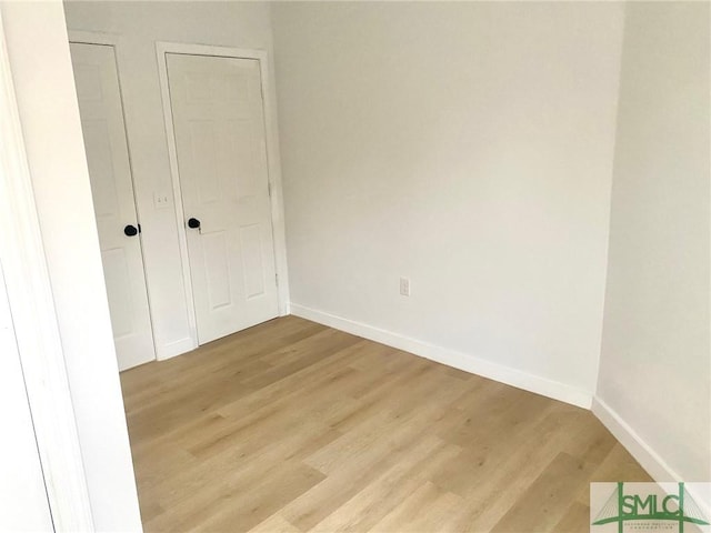 unfurnished bedroom featuring light wood-type flooring