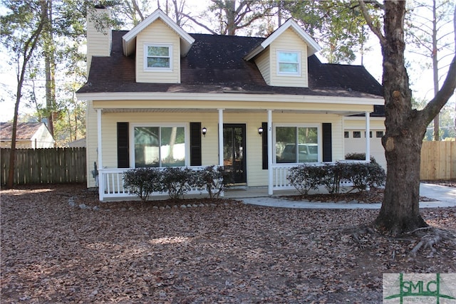 view of front of house with a porch and a garage