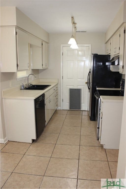 kitchen with pendant lighting, range, sink, black dishwasher, and white cabinetry