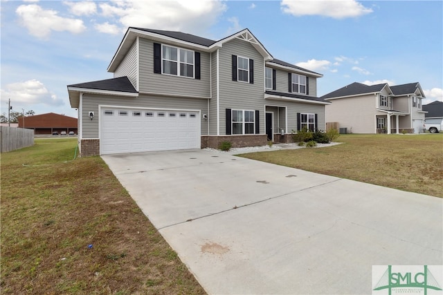 view of front of property with a front yard and a garage