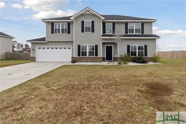 view of front property with a front yard and a garage