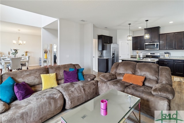 living room featuring a notable chandelier