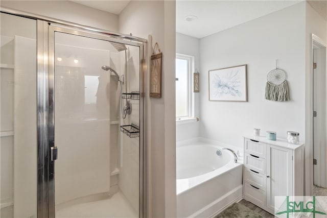 bathroom with shower with separate bathtub