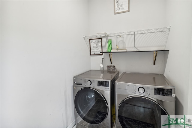 laundry area featuring washing machine and dryer