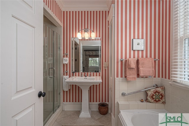 bathroom with tile patterned floors, crown molding, and a wealth of natural light