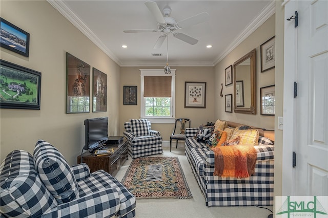 living room featuring ceiling fan, carpet floors, and ornamental molding