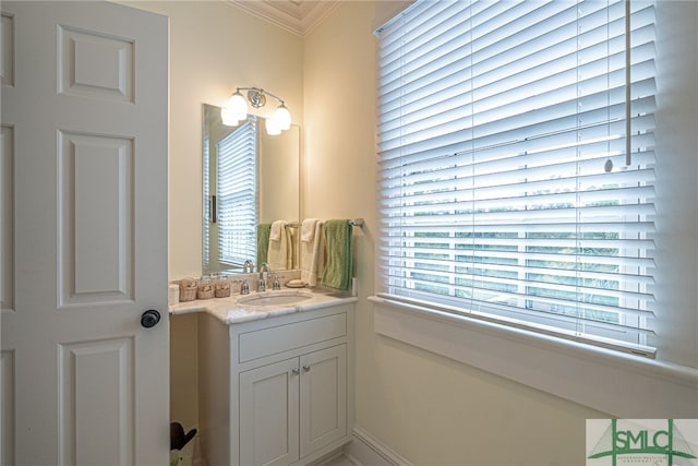 bathroom featuring vanity and ornamental molding