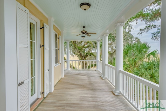 wooden deck with ceiling fan