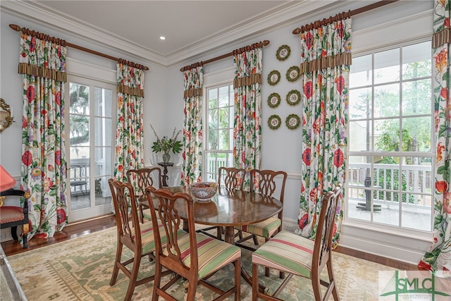 dining room featuring crown molding and wood-type flooring