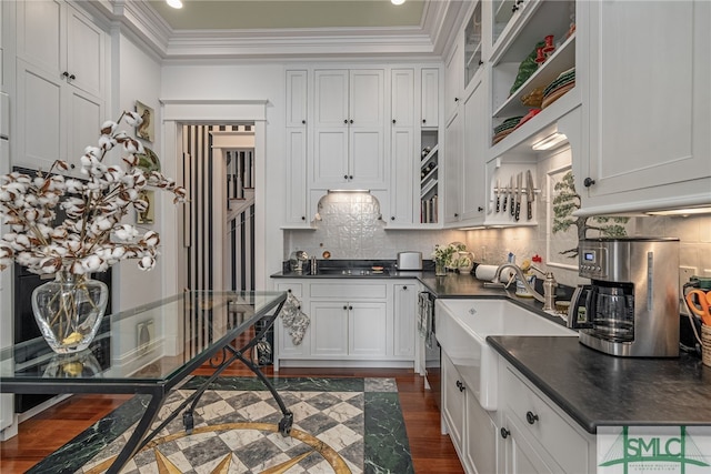 kitchen featuring white cabinetry, sink, dark wood-type flooring, and ornamental molding