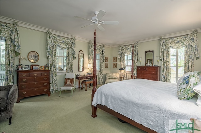 carpeted bedroom with access to exterior, ceiling fan, and ornamental molding