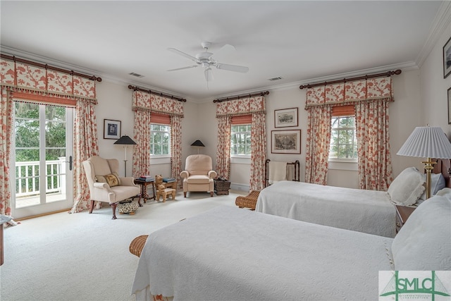 bedroom with access to exterior, ceiling fan, and multiple windows