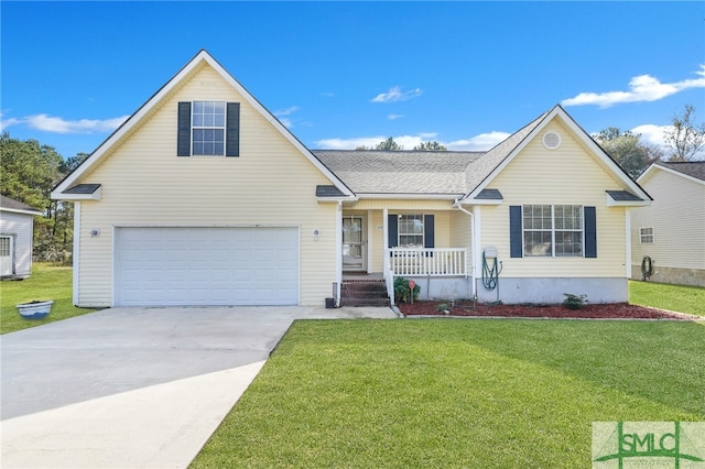 view of front of property featuring a garage, covered porch, and a front yard