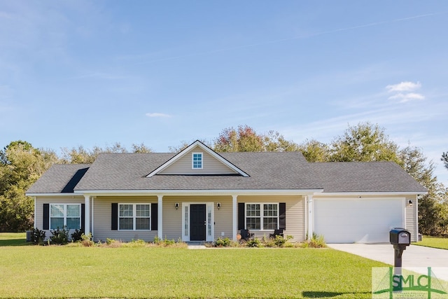 view of front of home featuring a garage and a front yard