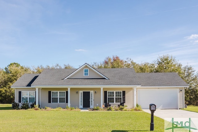 view of front of property with a front lawn and a garage