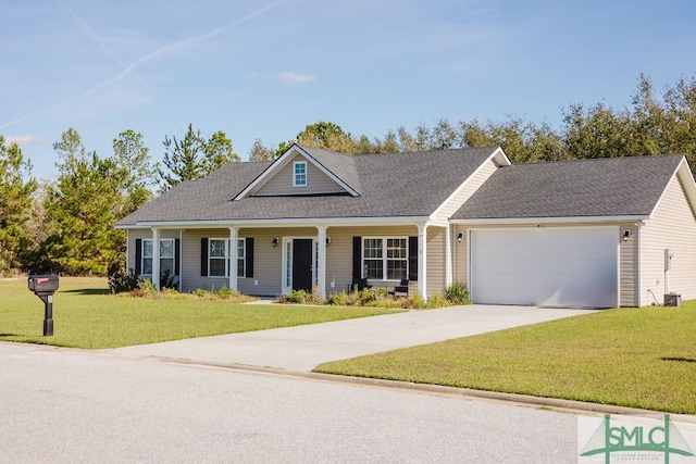 view of front of home featuring a front yard and a garage