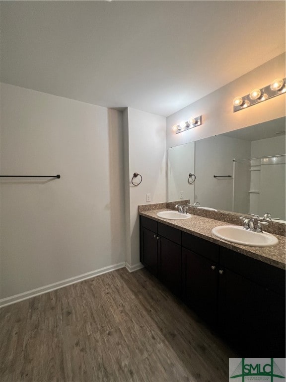 bathroom featuring vanity and wood-type flooring