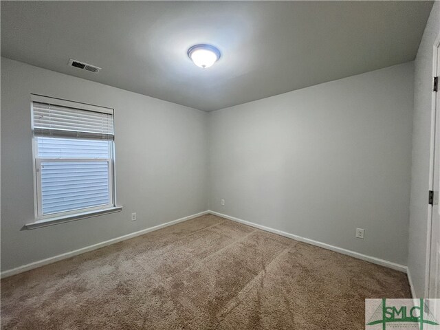 empty room featuring carpet flooring