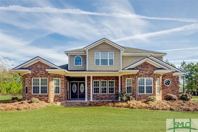 craftsman house featuring a front lawn