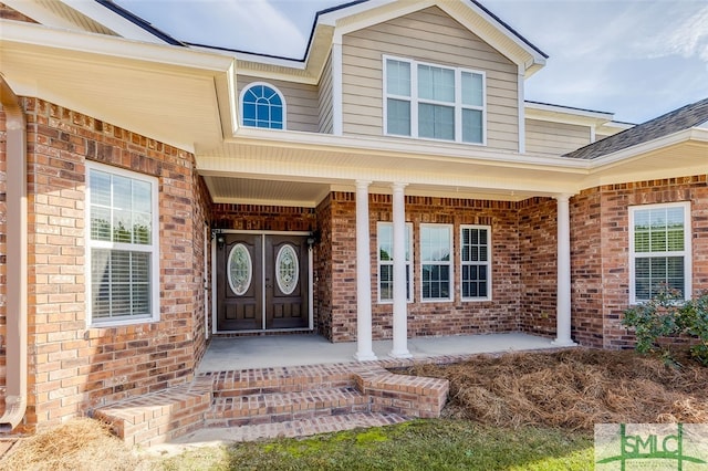 property entrance with covered porch