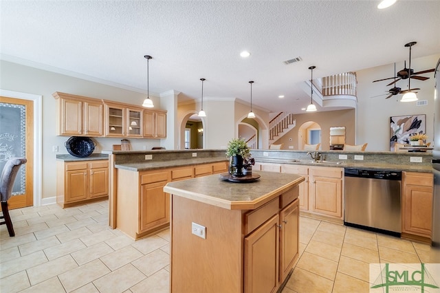 kitchen featuring stainless steel dishwasher, crown molding, pendant lighting, a textured ceiling, and a kitchen island