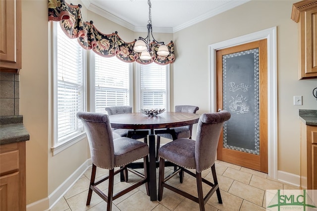 dining room featuring a notable chandelier, ornamental molding, and light tile patterned floors