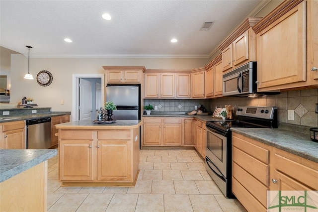 kitchen with decorative backsplash, light brown cabinetry, hanging light fixtures, and appliances with stainless steel finishes