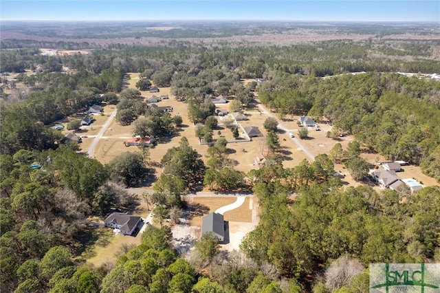 aerial view featuring a view of trees