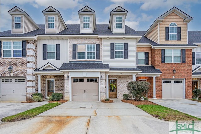 townhome / multi-family property featuring a garage