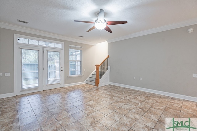 spare room with crown molding, ceiling fan, and a textured ceiling