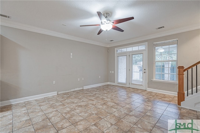 spare room featuring crown molding, a textured ceiling, and ceiling fan