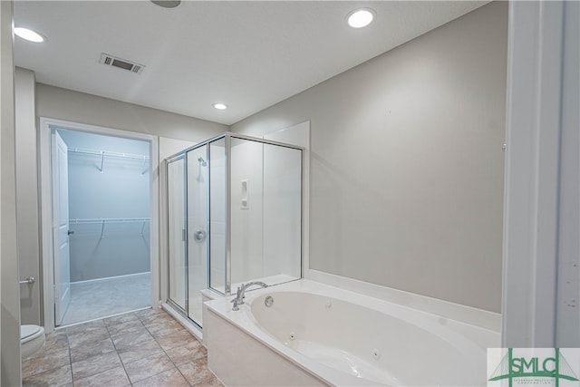 bathroom with separate shower and tub and toilet