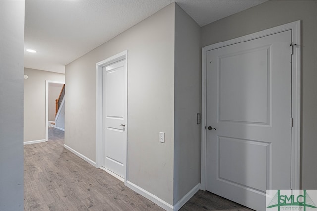 corridor featuring light hardwood / wood-style flooring