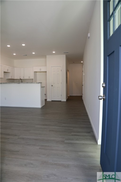 unfurnished living room with hardwood / wood-style flooring