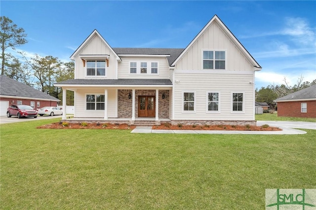 3250 Midland Rd, Guyton, GA 31312 - modern farmhouse style home with board and batten siding, a porch, and a front yard