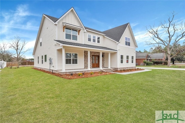 view of front of property with a front yard and a porch