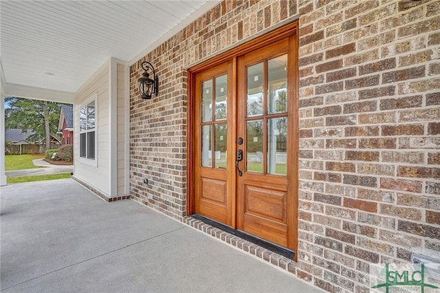 view of exterior entry featuring french doors