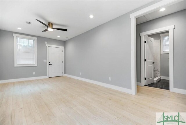 spare room featuring ceiling fan and light hardwood / wood-style flooring