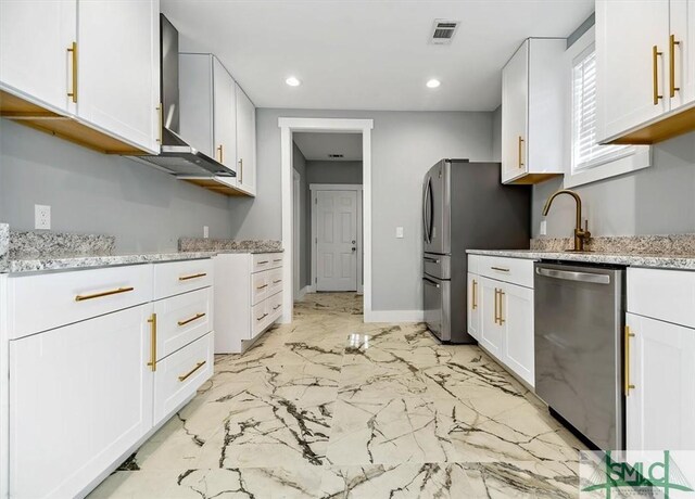 kitchen featuring light stone countertops, white cabinetry, sink, and stainless steel appliances