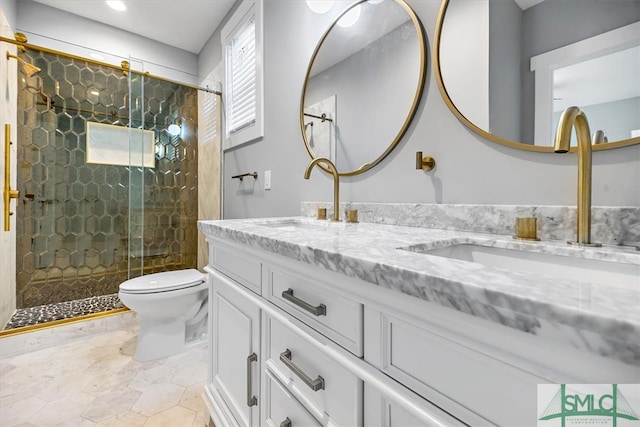 bathroom featuring walk in shower, vanity, and toilet