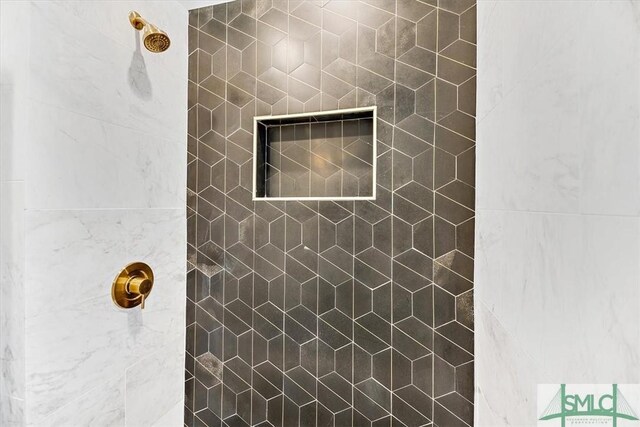 room details with tiled shower and a fireplace