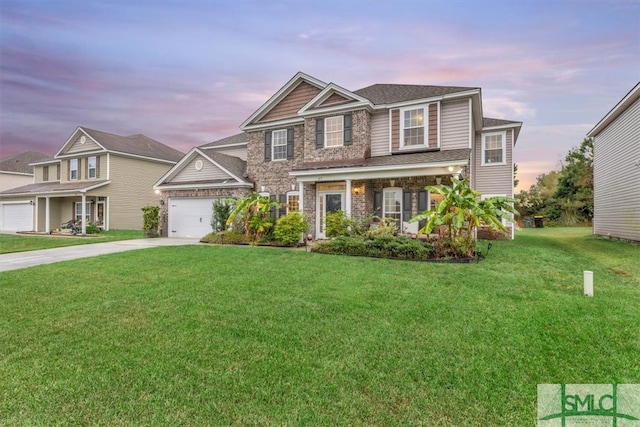 view of front of home featuring a porch, a garage, and a yard