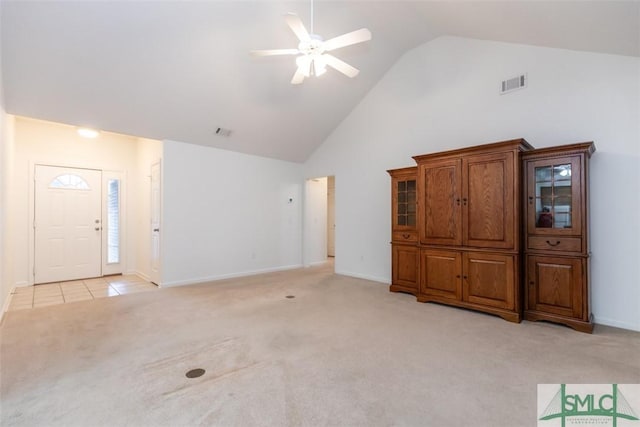 unfurnished living room featuring ceiling fan, light colored carpet, and high vaulted ceiling