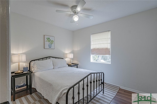 bedroom with hardwood / wood-style floors and ceiling fan