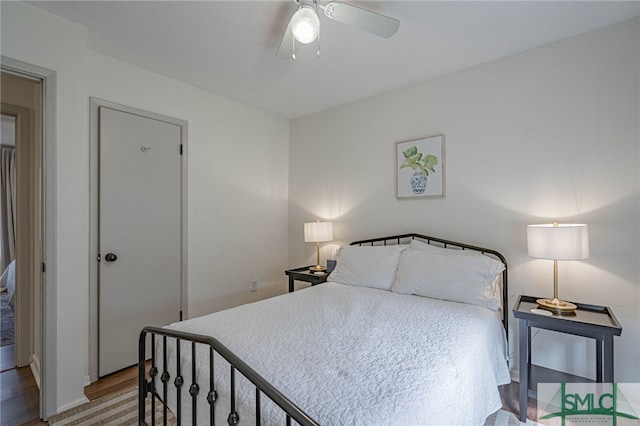 bedroom featuring light hardwood / wood-style floors and ceiling fan